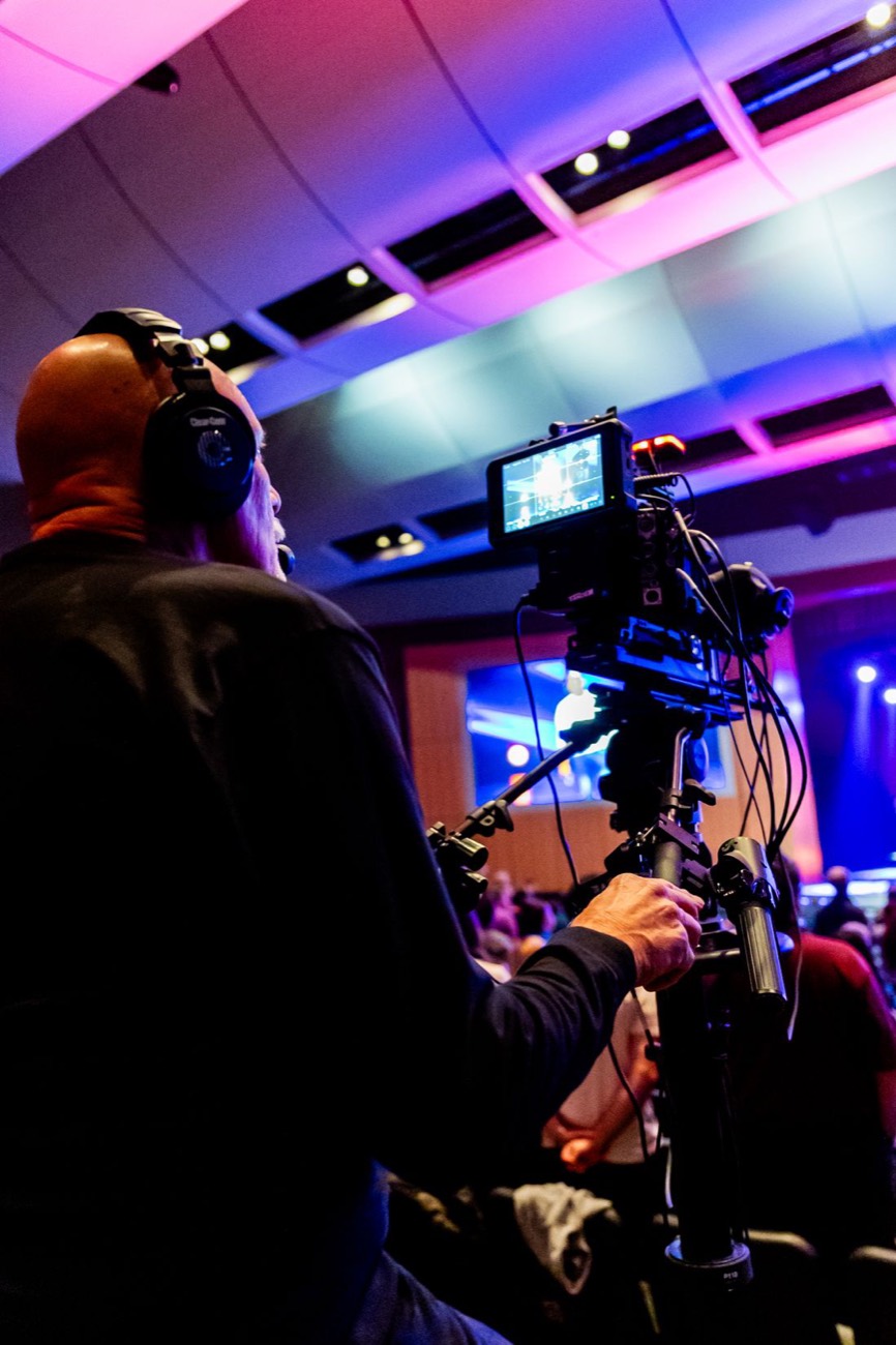 Camera operator capturing a live event